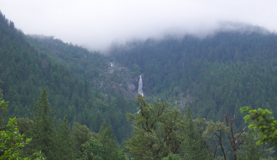 Looking across a valley at a waterfall