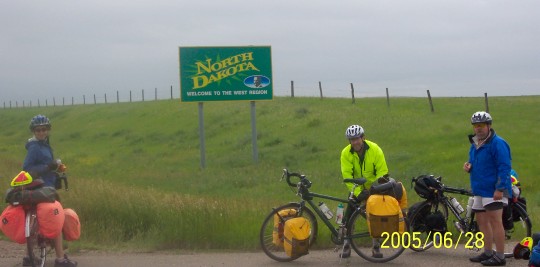 Maddy, Brendan, and Don at the Welcome to North Dakota sign