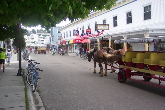 Street scene on Mackinac Island with horses and bicycles