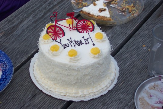Cake with bicycle decoration and 'You Made It!'