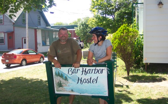 Don and Maddy at the Bar Harbor Hostel sign