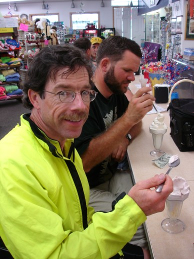Brendan and Eric eating ice cream at a counter