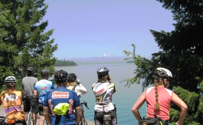 Cyclists looking across the lake at Mount Lassen
