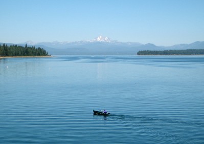 Rowboat on the lake with Mount Lassen in the distance