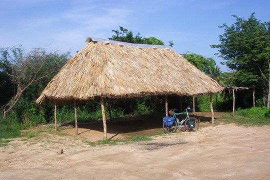 Thatched-roof 'palapa' with bike in front