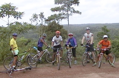 Six cyclists stopped on the trail for a short break