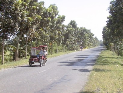 Country road with 4-wheeled motorcycle-like vehicle