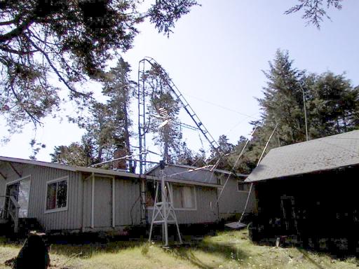 House with tower that is bent in the middle and damaged beam antenna